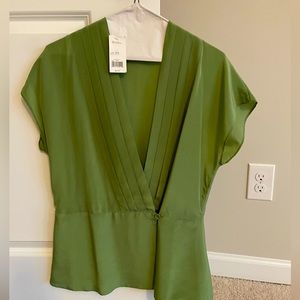 Beautiful classy green blouse.  Light weight and dainty.